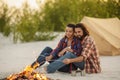 Couple Camping Near Campfire Royalty Free Stock Photo