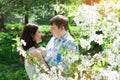 Young loving couple walking in a spring garden Royalty Free Stock Photo