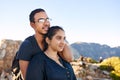 Young loving Indian couple in nature looking away optimistically Royalty Free Stock Photo