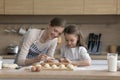 Young loving mother teach her preschooler daughter to cook Royalty Free Stock Photo