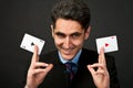 Young lucky gambler with cards Royalty Free Stock Photo