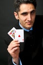 Young lucky gambler with cards