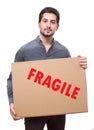 Young ma holding fragile cardboard shipment Royalty Free Stock Photo