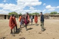 Young Maasai Askari doing a traditional jumping dance with tourist Royalty Free Stock Photo