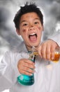 Young Mad Scientist Mixing Chemicals