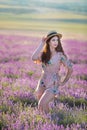 Young magic adorable woman in lavender field on summer day dancing and enjoy life time with woman girl power