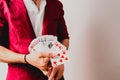 Young magician juggling a deck of playing cards