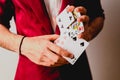 Young magician juggling a deck of playing cards