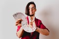 Young magician juggling a deck of playing cards