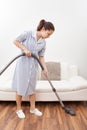 Young maid cleaning floor Royalty Free Stock Photo