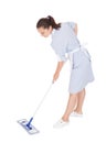 Young maid cleaning floor with mop Royalty Free Stock Photo