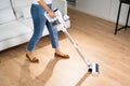 Young Maid Cleaning Floor Royalty Free Stock Photo