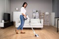 Young Maid Cleaning Floor Royalty Free Stock Photo