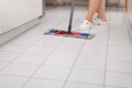 Young Maid Cleaning Kitchen Floor Royalty Free Stock Photo