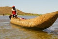 Young Malagasy rafter man rowing traditional canoe