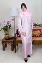 Young Malay woman in pink baju kurung, Royalty Free Stock Photo