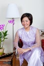 Young Malay woman in pink baju kurung,