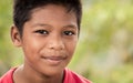 Young Malaysian boy smiles cheerfully