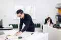 Young Male architect working on a project in a bright spacious office Royalty Free Stock Photo