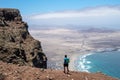 Young male with a backpack enjoying the mesmerizing beautiful seascape at daytime