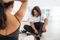 young male ballet dancers couple partners concentrated preparing before class african american man getting ready putting on dance Royalty Free Stock Photo