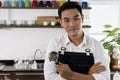 Young male Bartender in cafe restaurant. Royalty Free Stock Photo