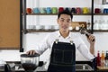 Young male Bartender in cafe restaurant. Royalty Free Stock Photo