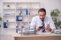 Young male bookkeeper in budget planning concept Royalty Free Stock Photo