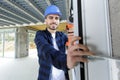 young male builder using power tool