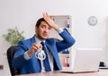 Young male businessman employee working in the office Royalty Free Stock Photo