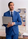 Young male businessman employee working in the office Royalty Free Stock Photo