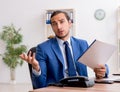 Young male businessman employee working in the office Royalty Free Stock Photo