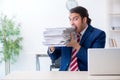 Young male businessman sitting in the office Royalty Free Stock Photo