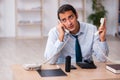 Young male call center operator working at his desk Royalty Free Stock Photo