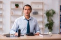 Young male call center operator working at his desk Royalty Free Stock Photo