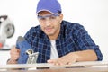 young male carpenter who works in workshop Royalty Free Stock Photo