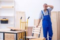 Young male carpenter working indoors Royalty Free Stock Photo