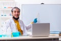Young male chemist student preparing for exam Royalty Free Stock Photo