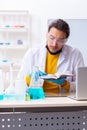 Young male chemist student preparing for exam Royalty Free Stock Photo