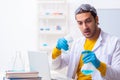 Young male chemist student preparing for exam Royalty Free Stock Photo