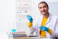 Young male chemist student preparing for exam Royalty Free Stock Photo