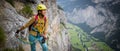 Pretty, female climber on a via ferrata Royalty Free Stock Photo