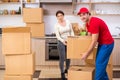 Young male contractor and female customer in moving concept Royalty Free Stock Photo