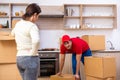 Young male contractor and female customer in moving concept Royalty Free Stock Photo