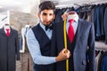 Young male is creating business image with red tie Royalty Free Stock Photo