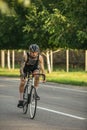 Young male cyclist riding a road bike in summer day. Action, motion concept Royalty Free Stock Photo