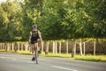 Young male cyclist riding a road bike in summer day. Action, motion concept Royalty Free Stock Photo