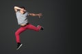 Young male dancer jumping in studio. Royalty Free Stock Photo