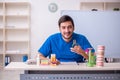 Young male dentist lecturer in front of whiteboard Royalty Free Stock Photo
