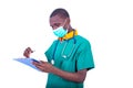 Young male doctor checking notes on clipboard Royalty Free Stock Photo